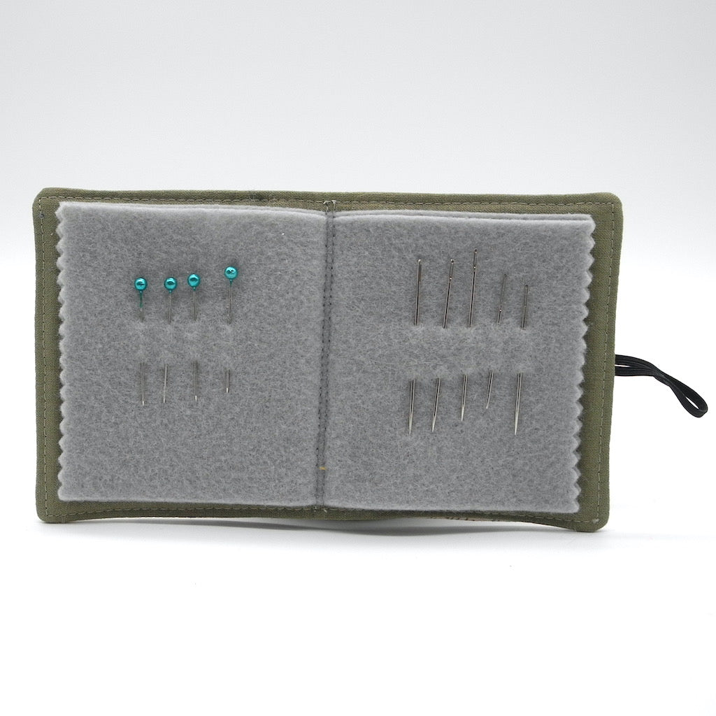 knitting book open showing needles